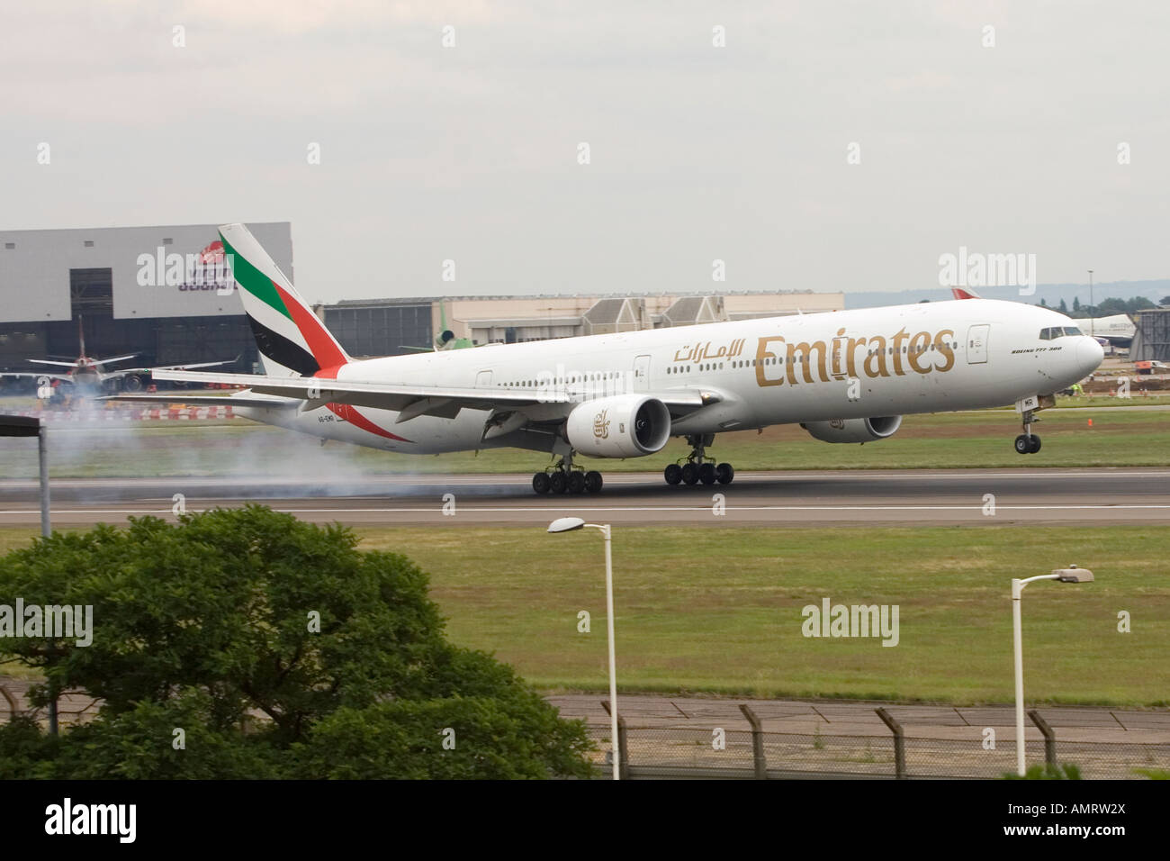 Emirates boeing 777 landing at London Heathrow LHR Airport Stock Photo