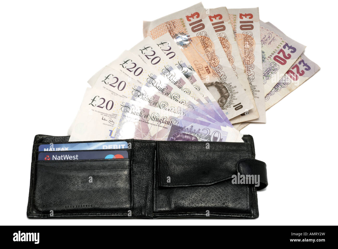 Black leather wallet spilling paper money Stock Photo