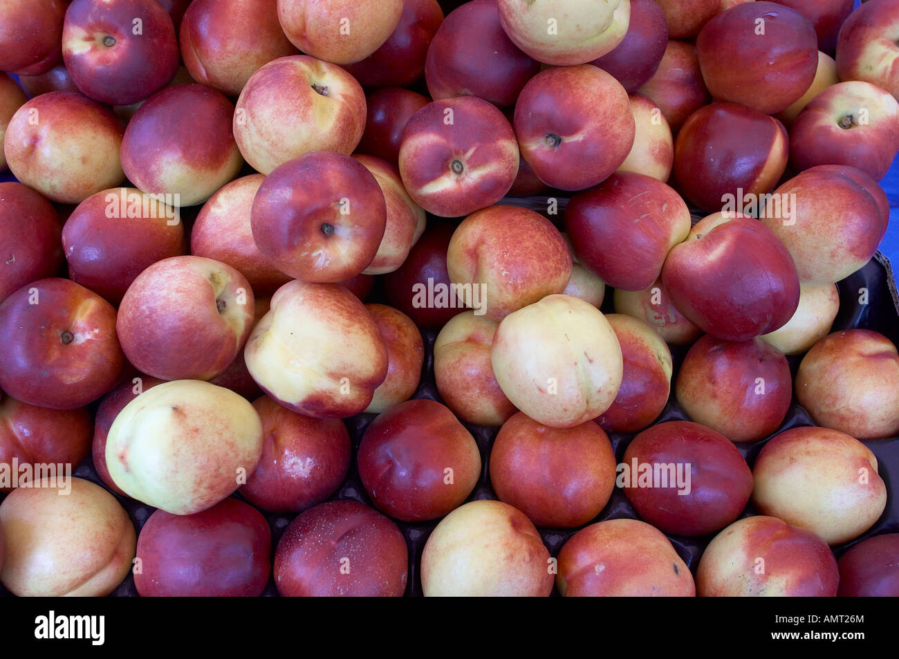 Closeup view with a nectarine box market place scenery in Kerkrade