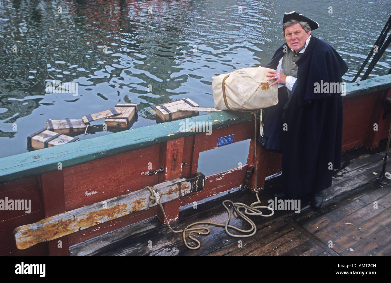 'Boston Tea Party' reenactment of  throwing tea chest into the sea in Boston  Harbour  ,USA 1773 Stock Photo