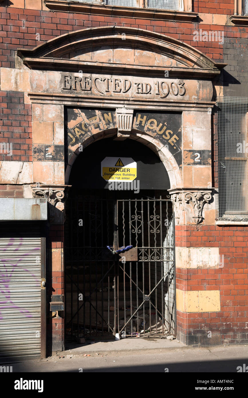 Early C20th derelict warehouse with terracotta detailing in classical style Ancoats Manchester UK 2006 on Radium Street Stock Photo