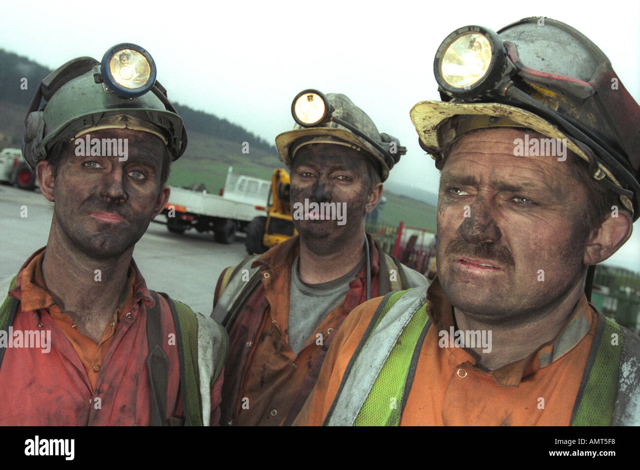 Black faced coal miners after finishing their shift at Tower Colliery Deep Mine Hirwaun South Wales UK Stock Photo