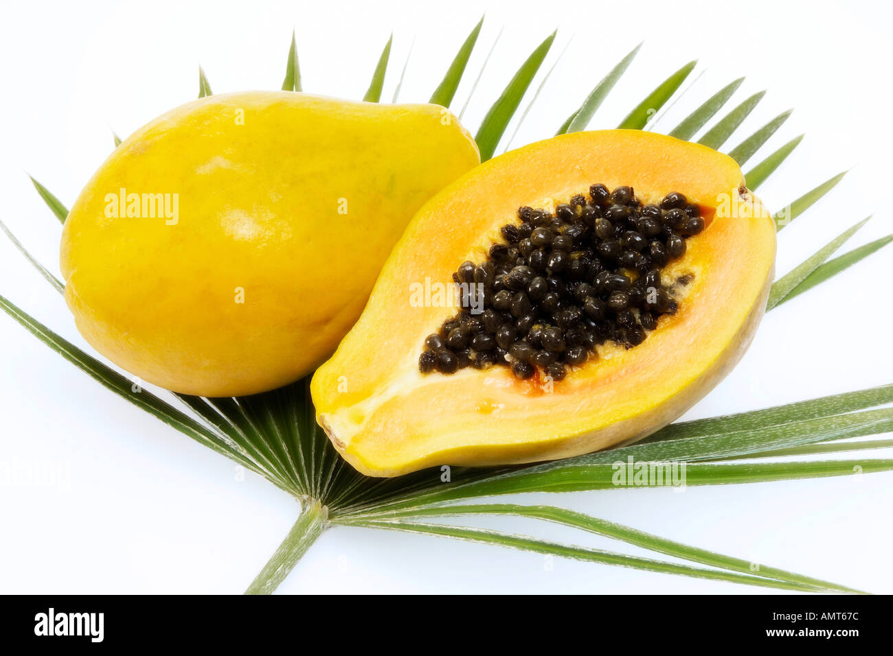 Papayas on palm leaf Stock Photo Alamy