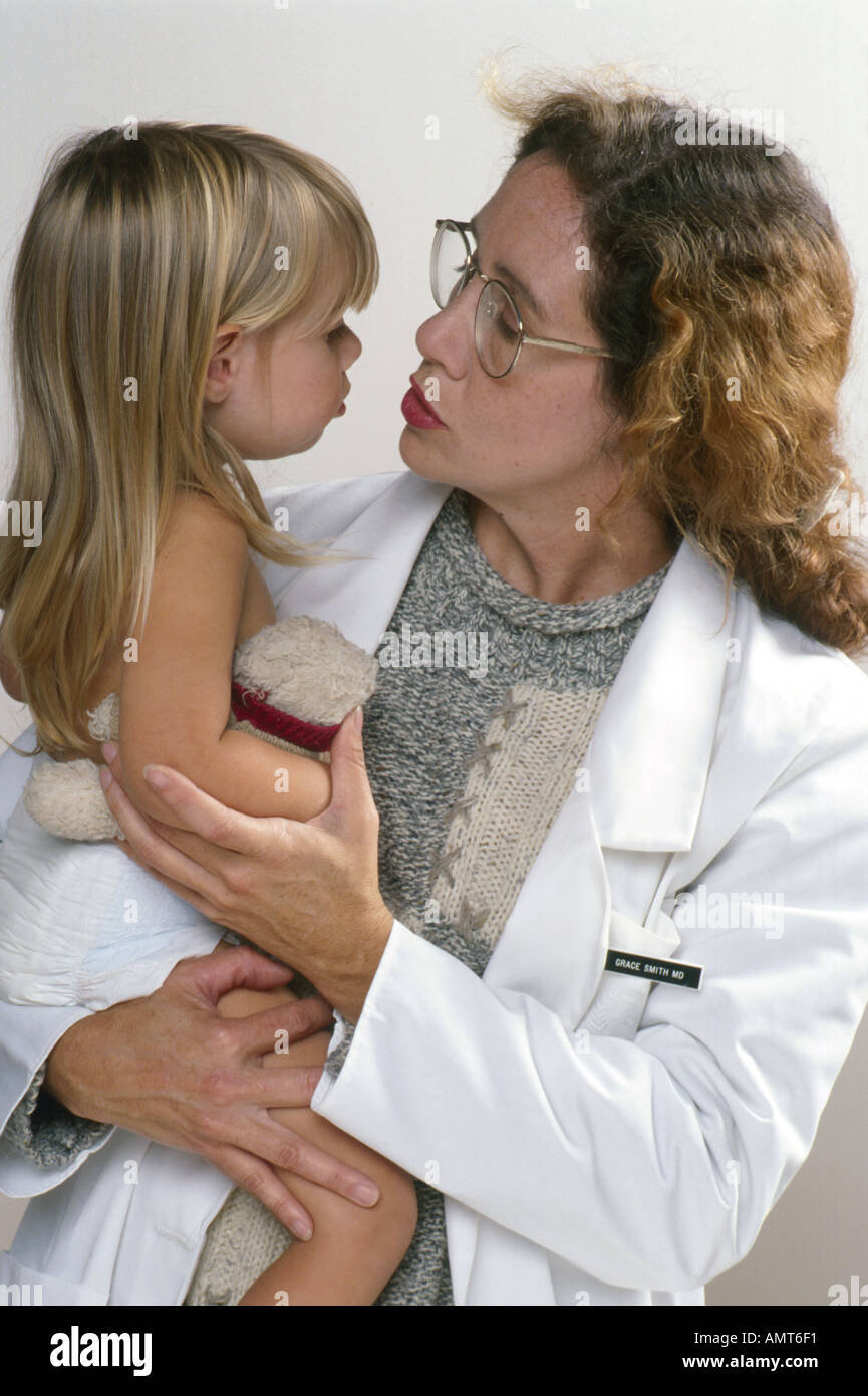 Doctor comforting baby hi-res stock photography and images - Alamy