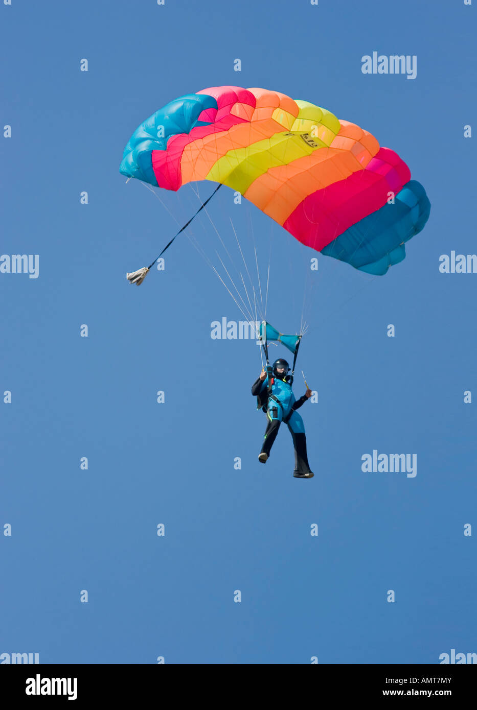 Skydiver with Rainbow colored parachute Stock Photo Alamy