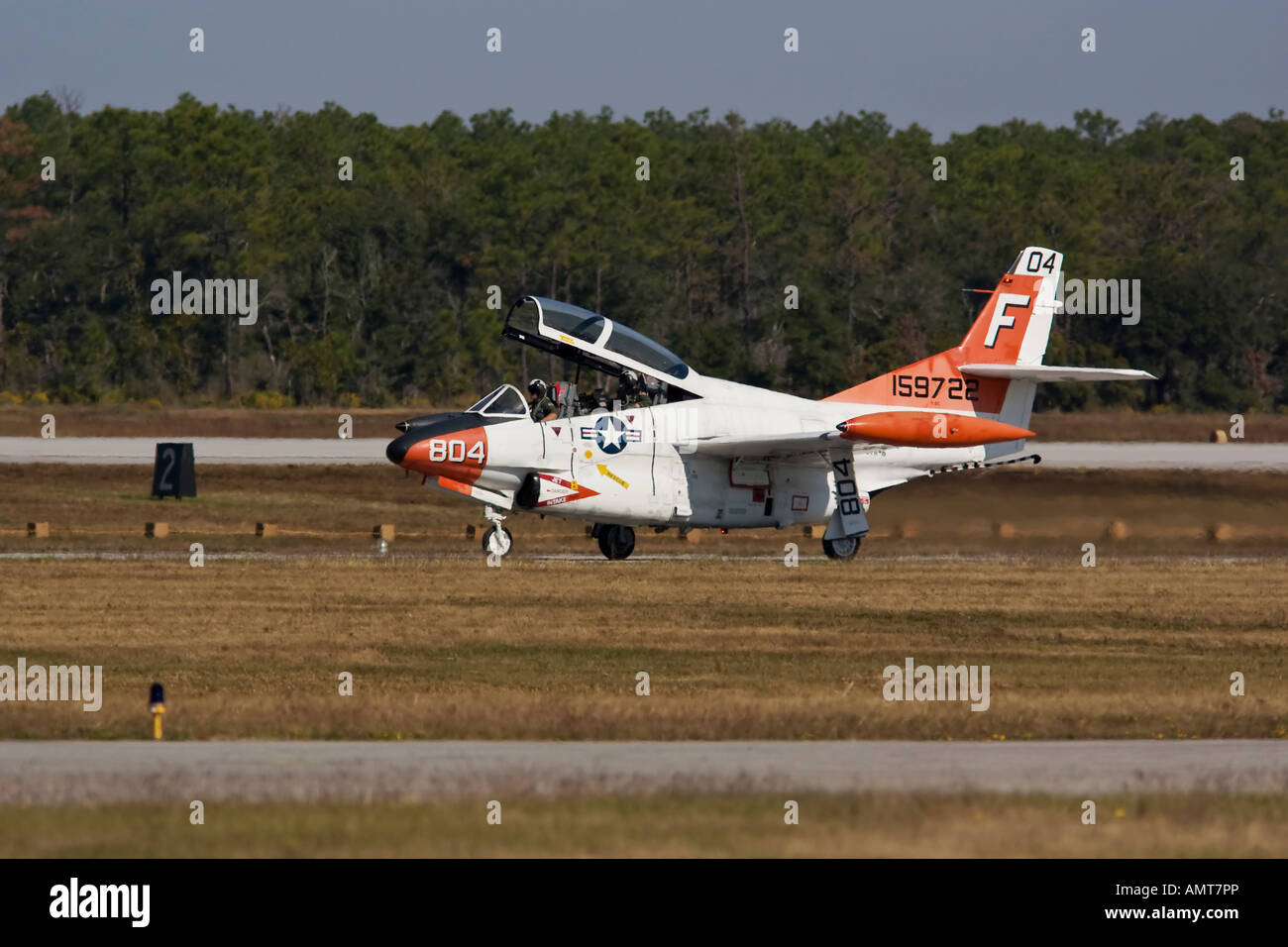 T-2 Buckeye taxiing down runway after landing at airshow Stock Photo
