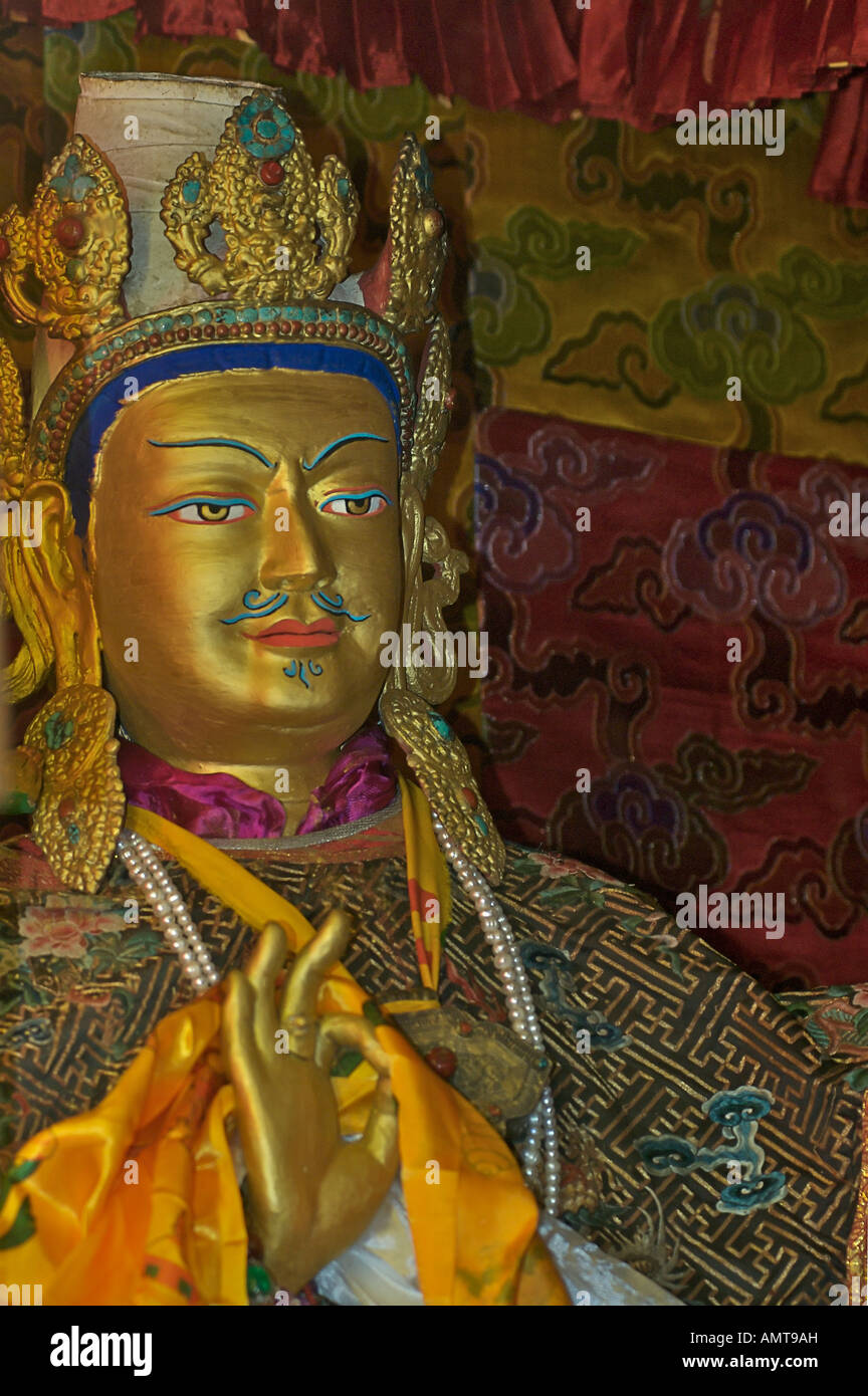 Detail of ornately carved gilded Buddhist statuary of a previous Dalai Lama in Samye Monastery Tibet Stock Photo