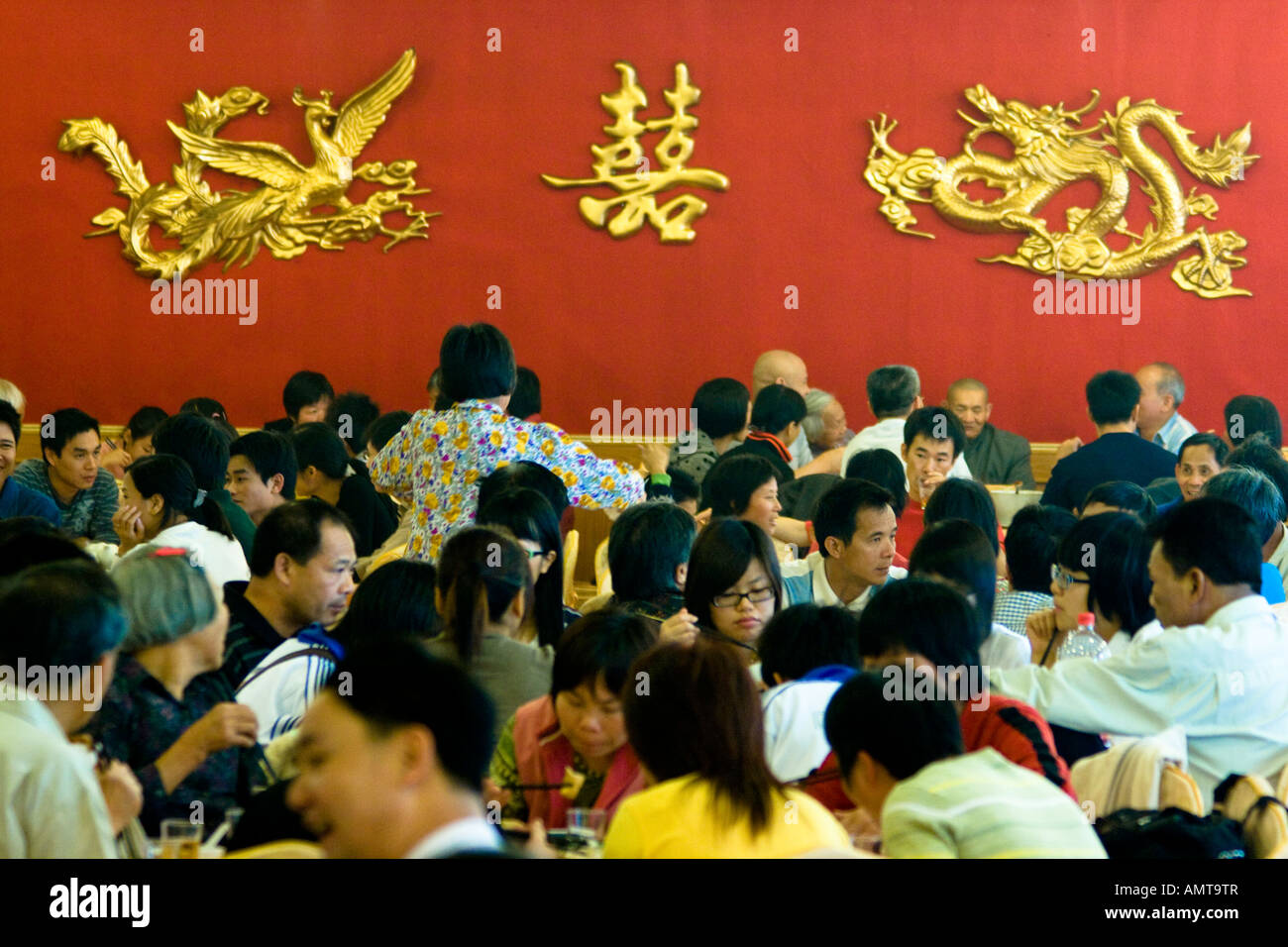Chinese People Eating inside a Chinese Restaurant Hong Kong China Stock Photo