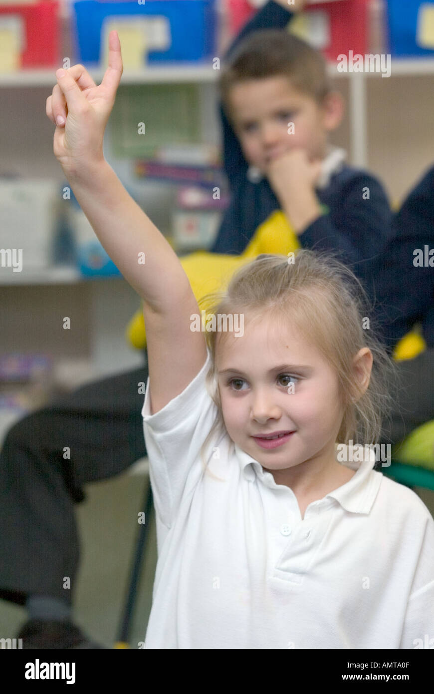 Child putting hand up in class hires stock photography and images Alamy