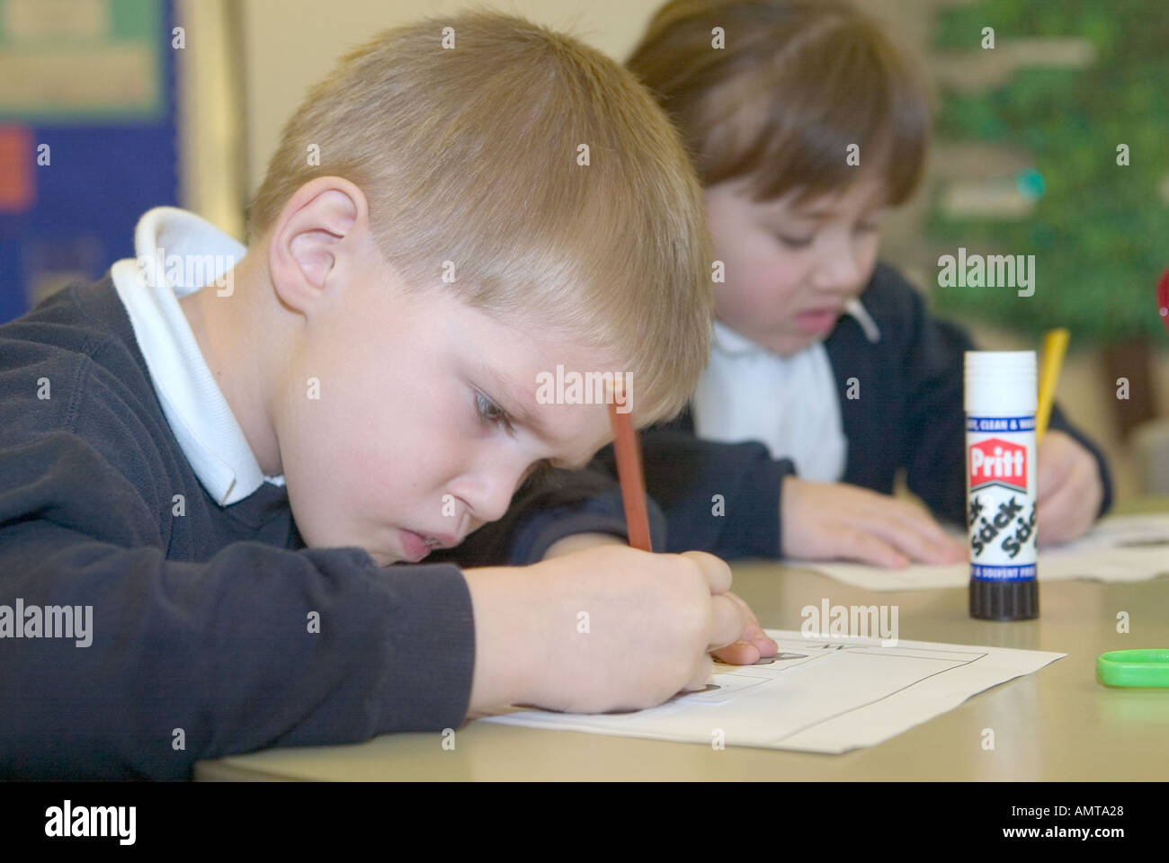 Children learning to draw in an infants school in England Stock Photo