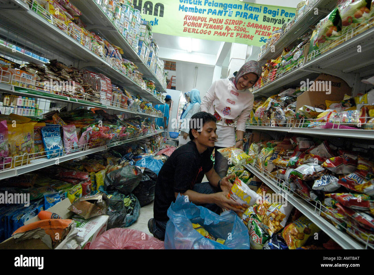 Pante Pirak Supermarket employee Mhadi stocks shelves in Banda Aceh Indonesia on Thursday Jan 6 2005 Pante Pirak was the first s Stock Photo