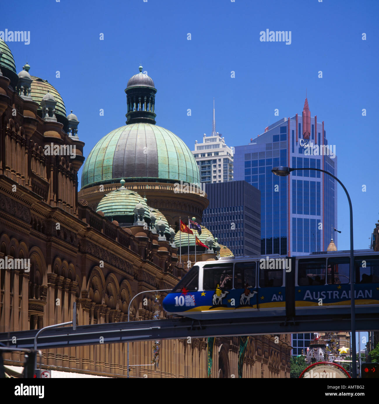 Upper level roof of beautiful elegant red stone with copper dome at Queen Victoria Building and Monorail Sydney Australia Stock Photo