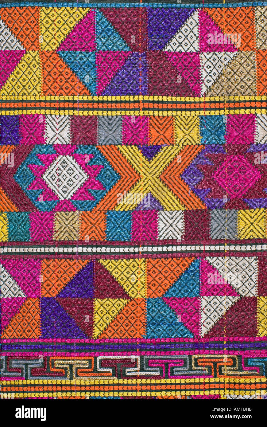 Detail of Bhutanese brocaded fabric with sumptuous supplementary weft brocading Woven on a hip strap loom Bhutan Stock Photo