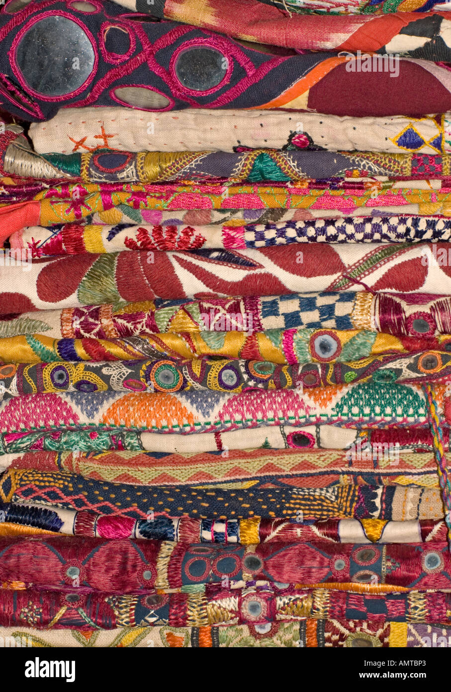 Stack of embroidered and applique textiles from Rajahstan India Stock Photo