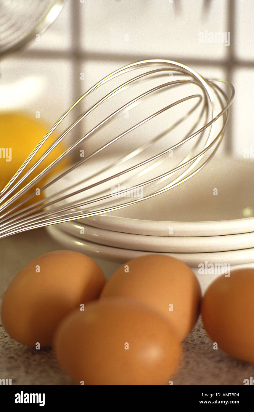https://c8.alamy.com/comp/AMTBR4/eggs-egg-beater-and-porcelain-bowls-on-a-kitchen-bench-AMTBR4.jpg