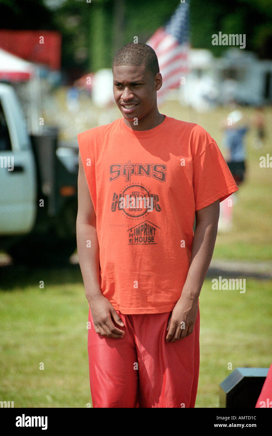 Black 16 Year Old Male Focuses On A 3 On 3 Basketball Game Stock Photo black-16-year-old-male-focuses-on-a-3-on-3-basketball-game-stock-photo