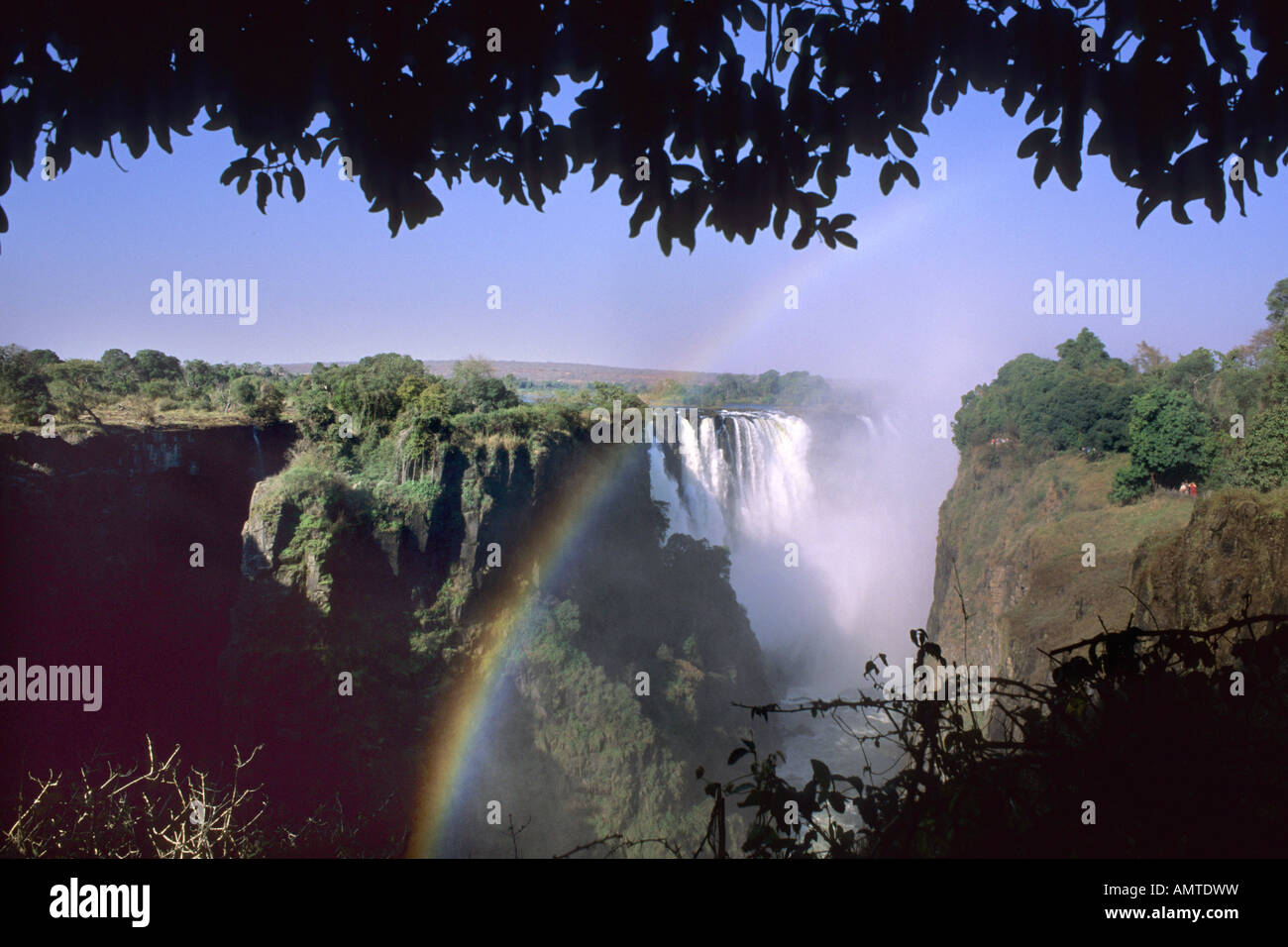 View of the Victoria Falls with partial rainbow Stock Photo