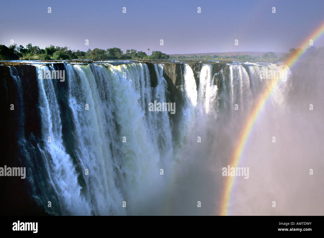 View of the Victoria Falls with partial rainbow Stock Photo