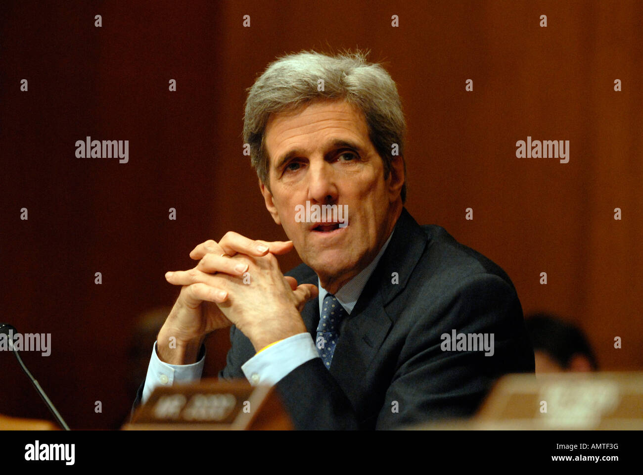 Senator John Kerry D MA speaks to Secretary of State Condoleezza Rice during a Senate Foreign Relations Committee hearing in Was Stock Photo