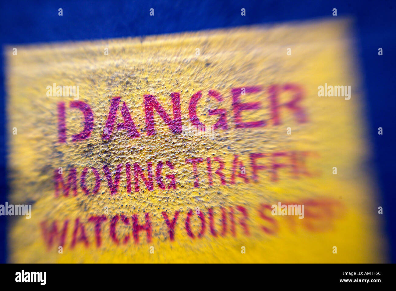 DANGER Moving Traffic, Watch Your Step sign Stock Photo
