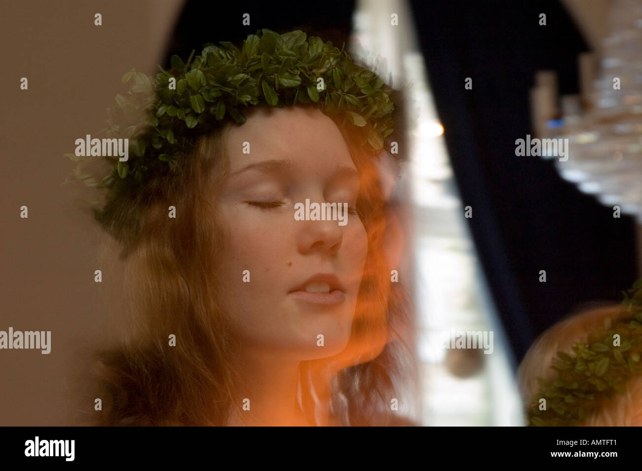 Face of a girl with crown at Santa Lucia, lightfestival celebrated on 13th december in Scandinavia Stock Photo