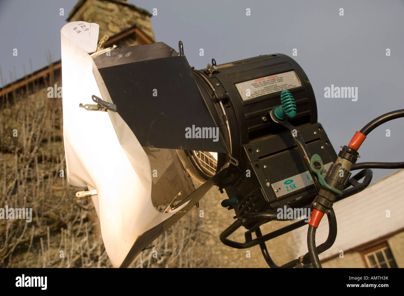 Large 2.5kw film lantern light with scrim clipped to the barn doors to