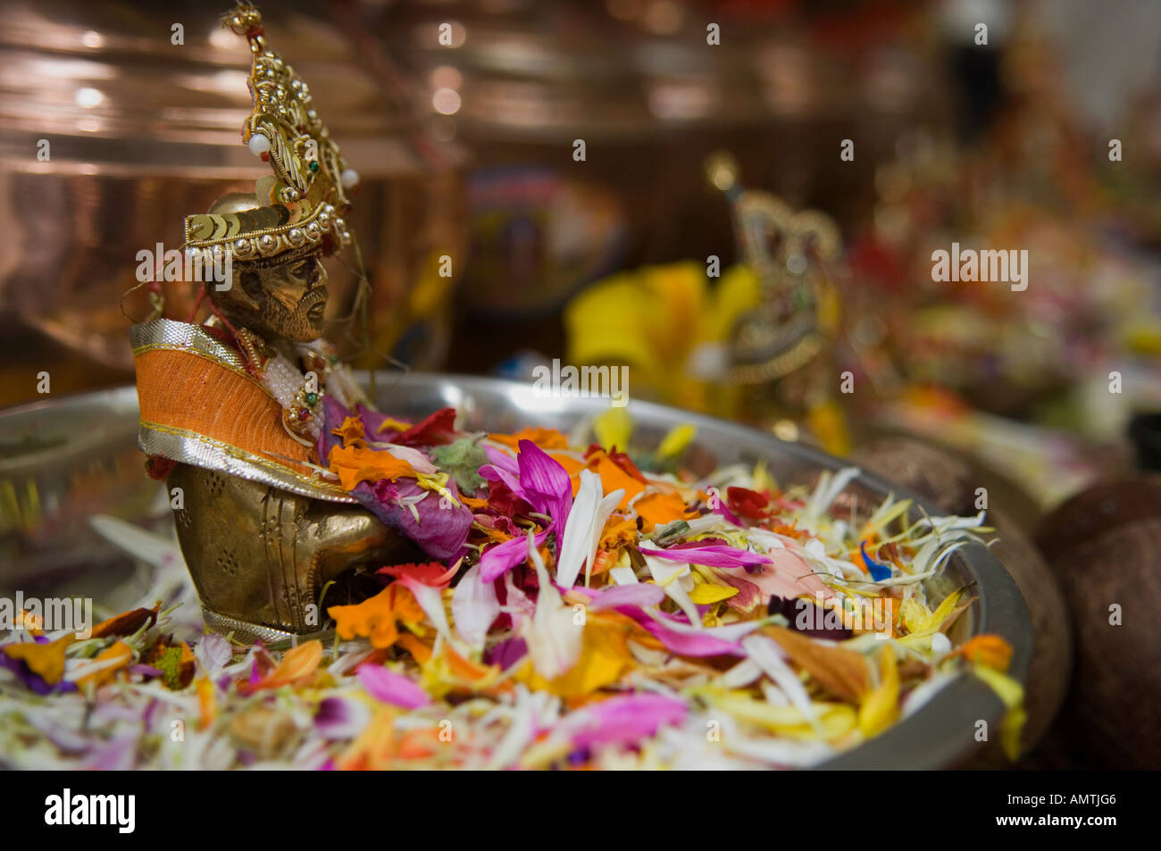 Tray of flower petals and offerings in Hindu temple Stock Photo