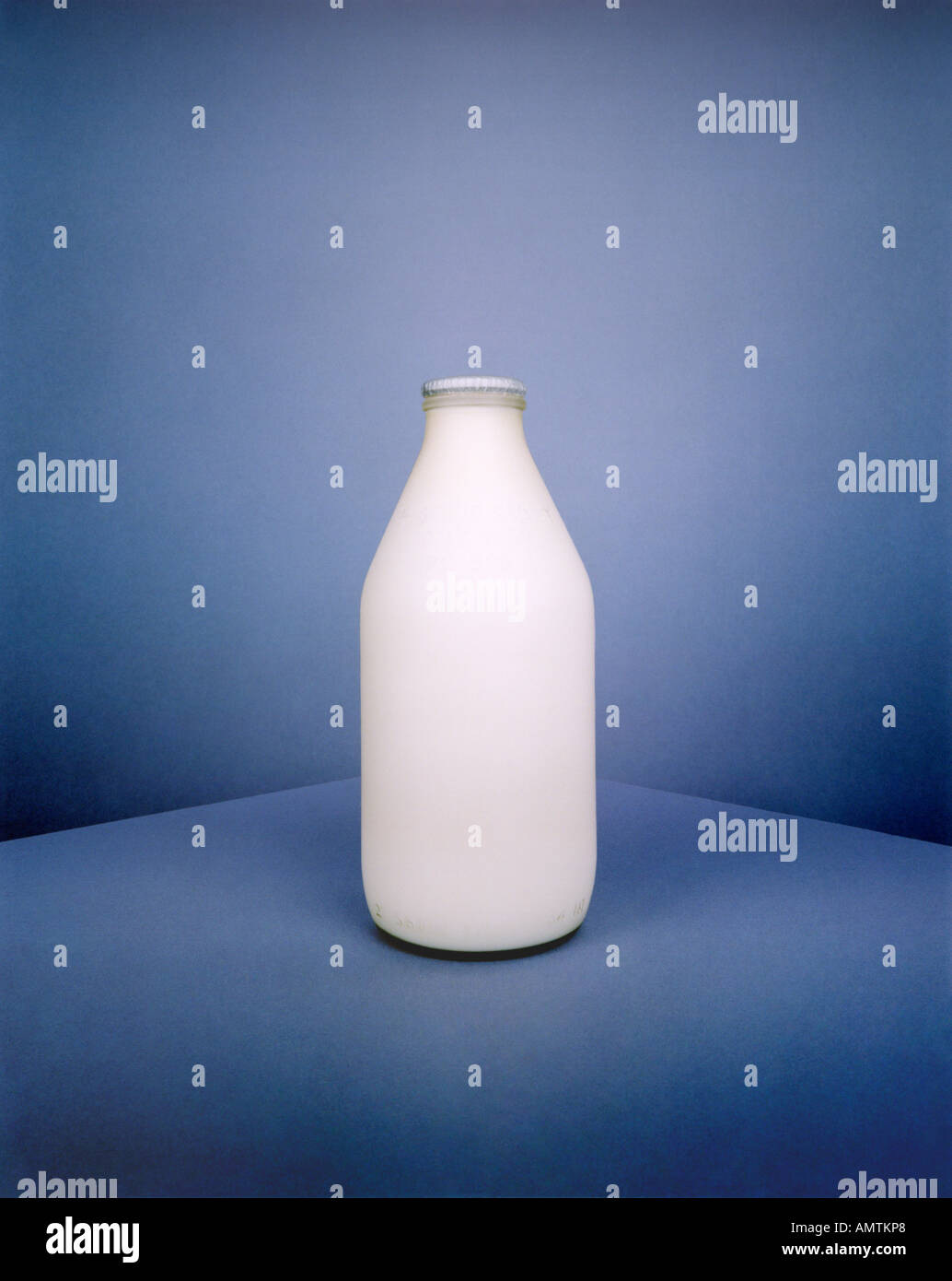 Still life of pint bottle of milk explores colour shape form and space Stock Photo