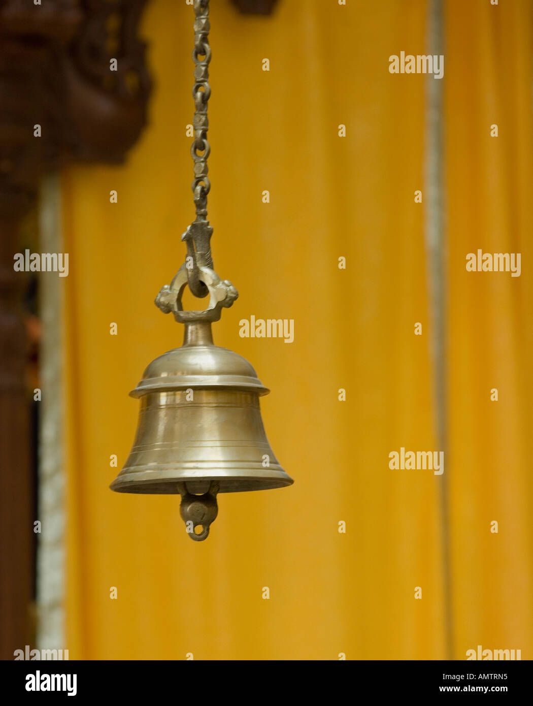 Brass bell hanging from ceiling hi-res stock photography and