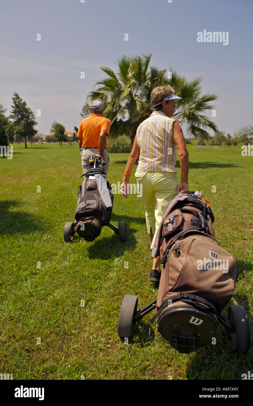 Women pulling golf carts hi res stock photography and images Alamy