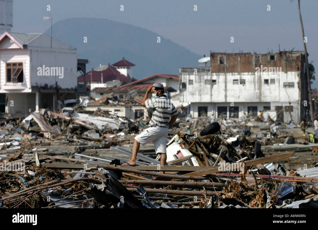 A man surveys the distruction in Banda Aceh Indonesia on Thursday Jan 6 2005 Stock Photo