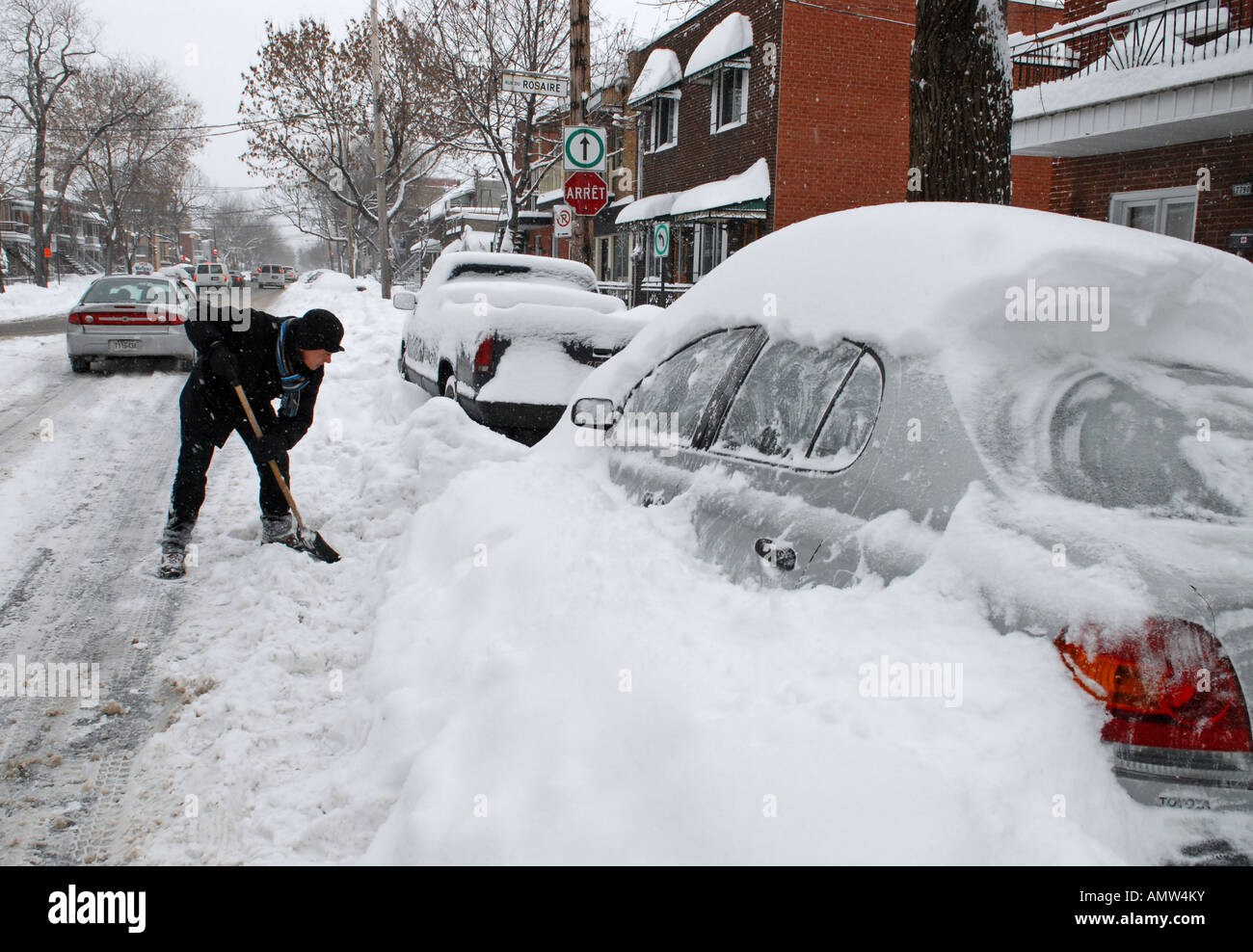 Men cleaning his car after a major snow storm Montreal Quebec Canada ...