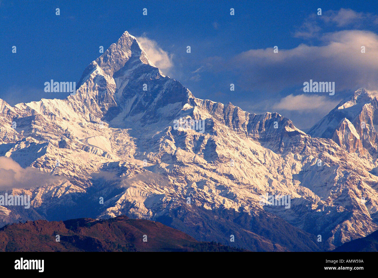 Macchapucchre the Fishtail Mountain part of the Annapurna range in the Himalayas seen from Pokhara Nepal Stock Photo