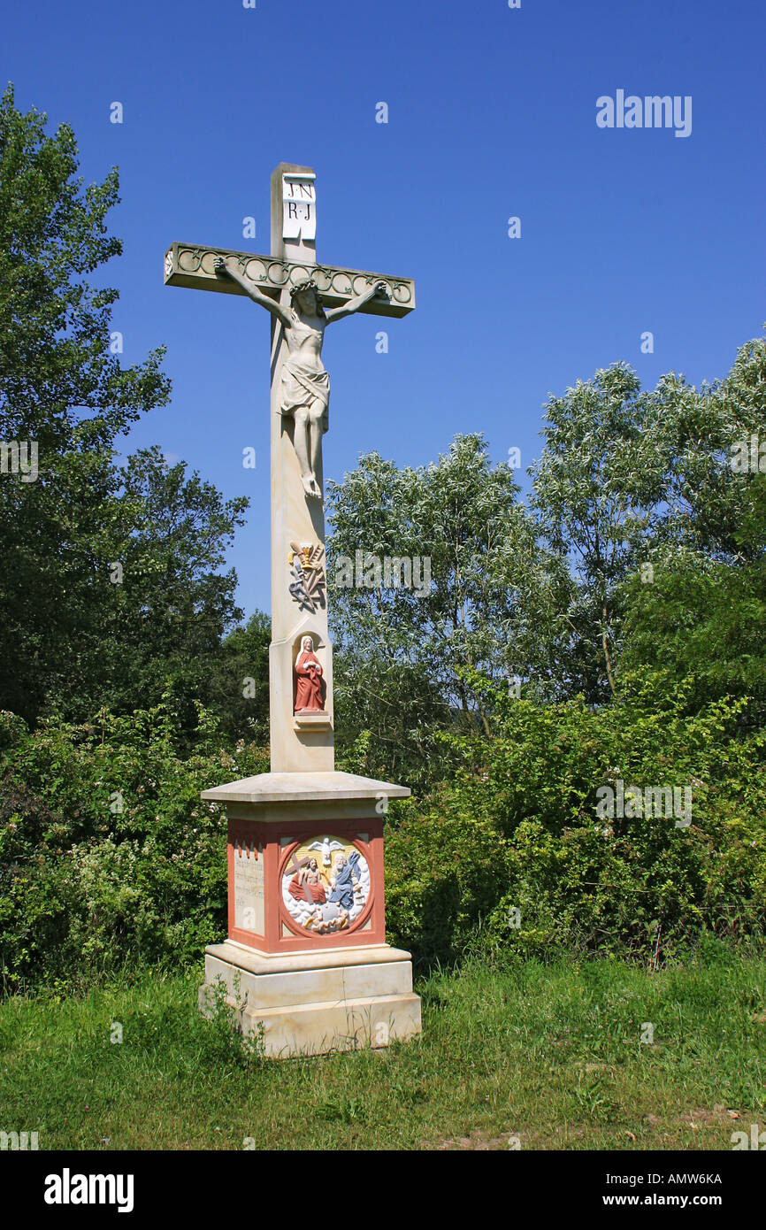 Historical cross with statue of the crucified Jesus Stock Photo