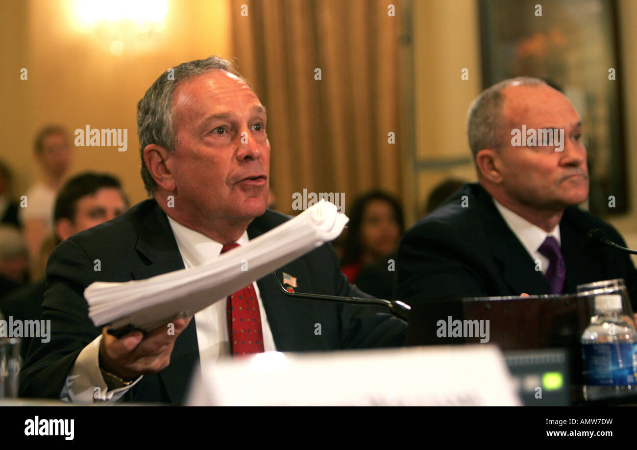 Mayor Michael Bloomberg holds up a bundle of documents which make up a copy of the application form Stock Photo