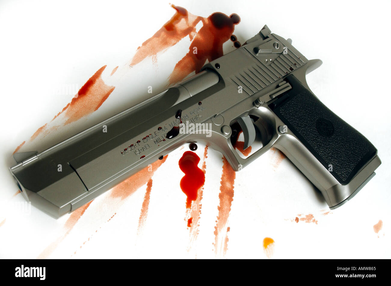 a desert eagle gun pistol with blood stains Stock Photo