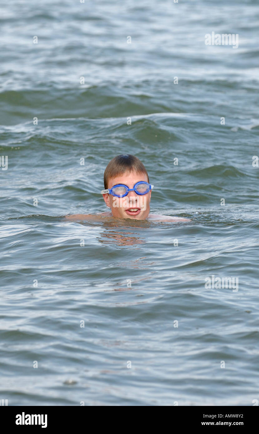 Boy swims in the sea Stock Photo - Alamy