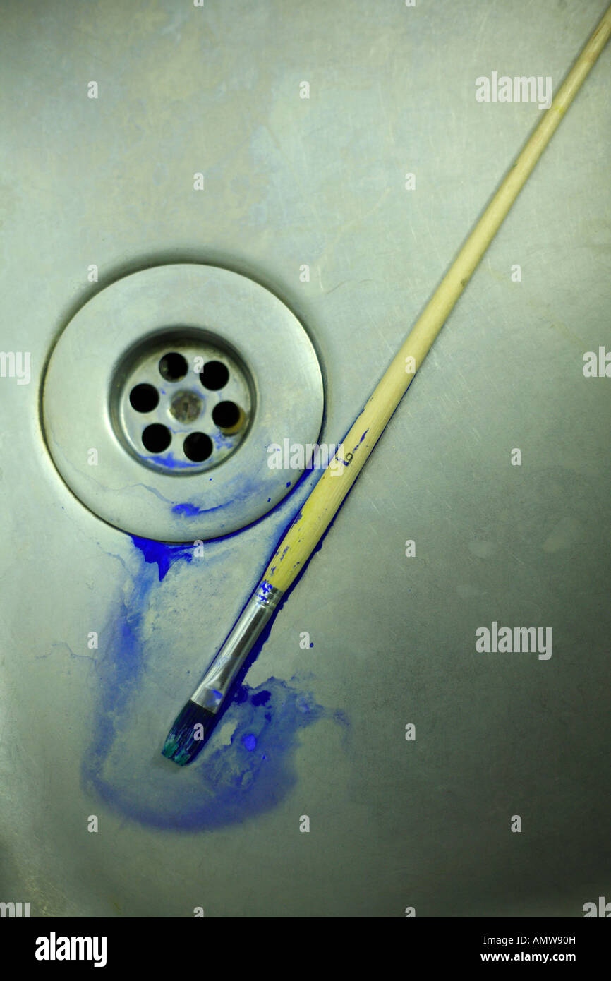 Paintbrush with blue paint in a stainless steel sink Stock Photo Alamy