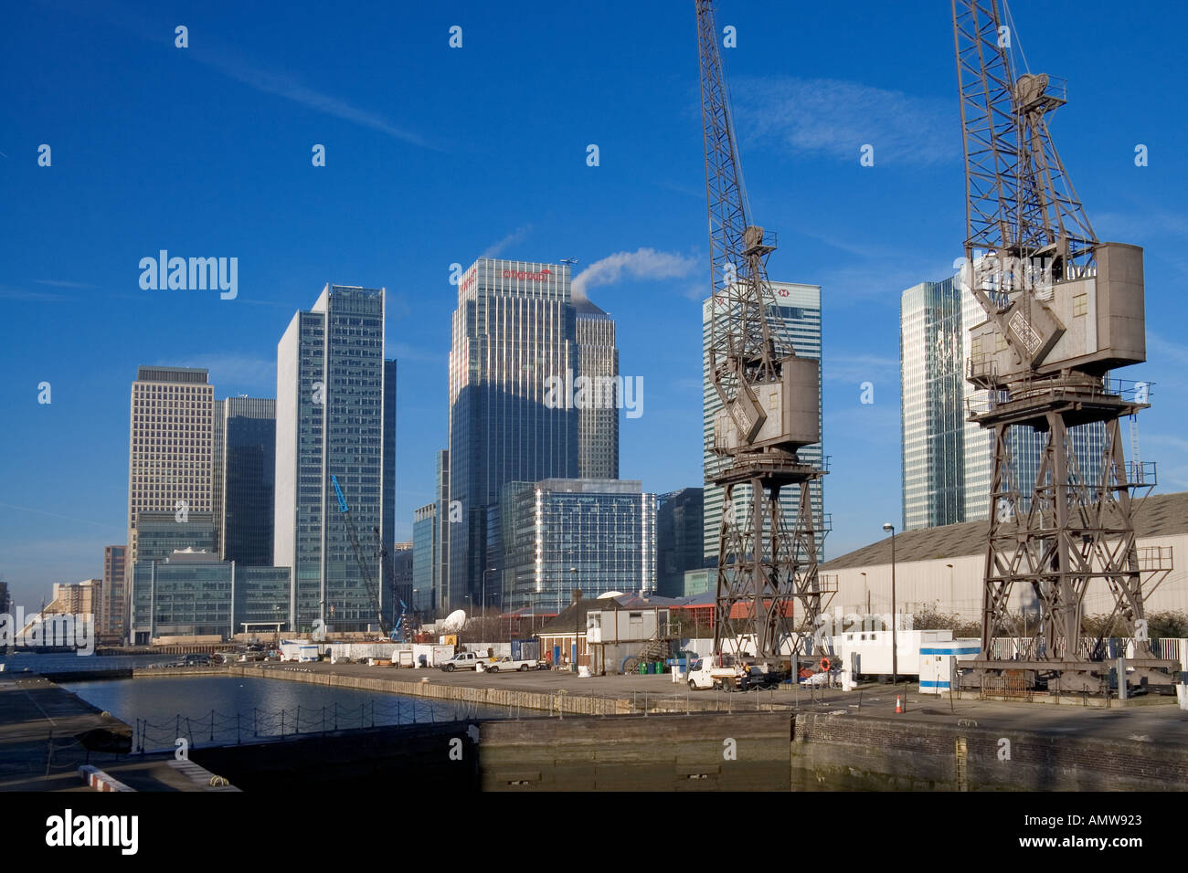 Modern office buildings at Canary Wharf London with cranes in the ...
