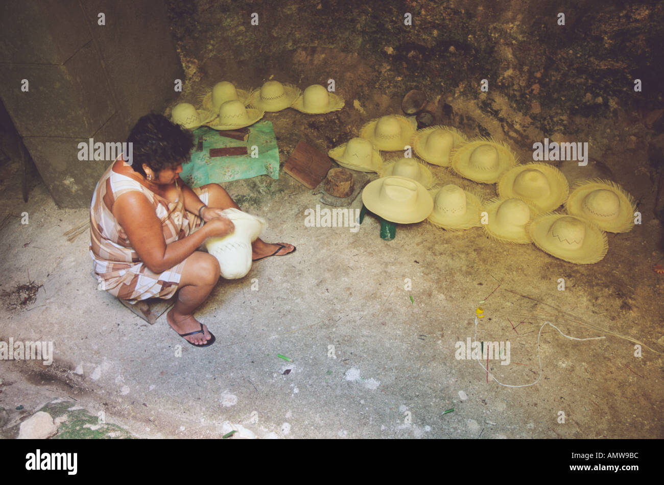 A woman making Panama hats in a cave near the town of Becal in the Yucatan Peninsula Mexico Stock Photo