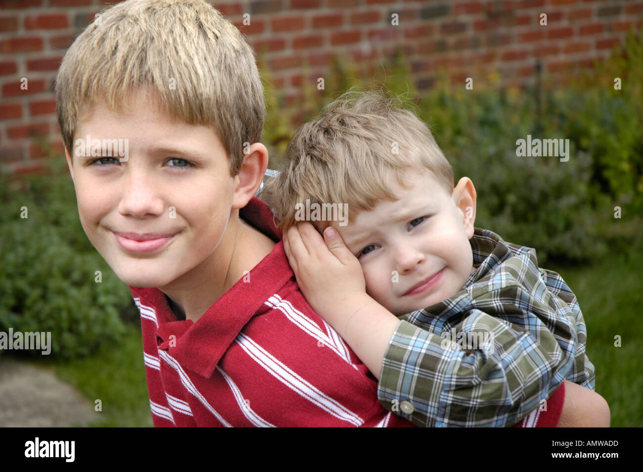 Kids in same family playing together at family gathering Stock Photo