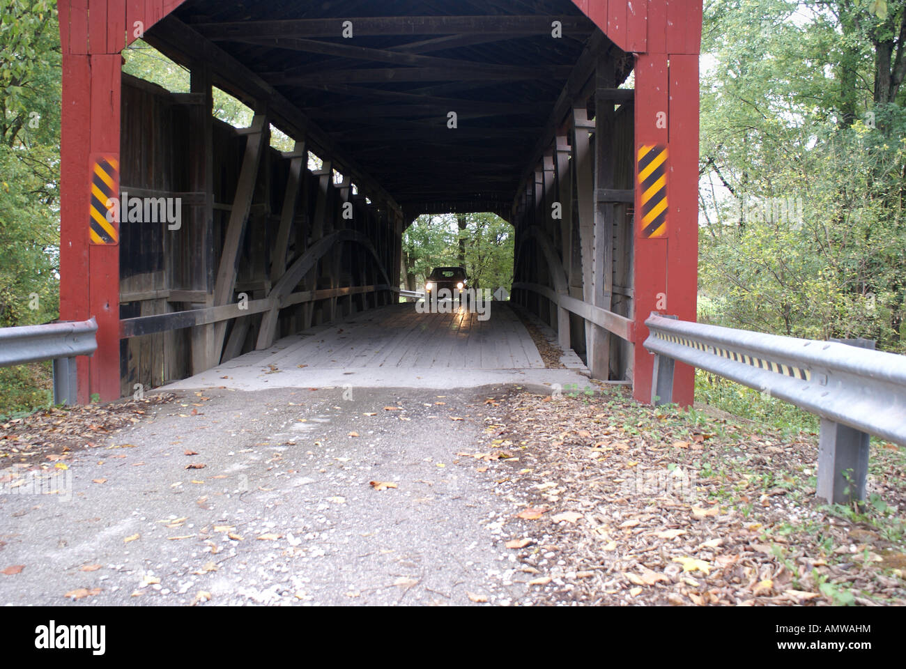 Car coming through Covered Bridge Stock Photo