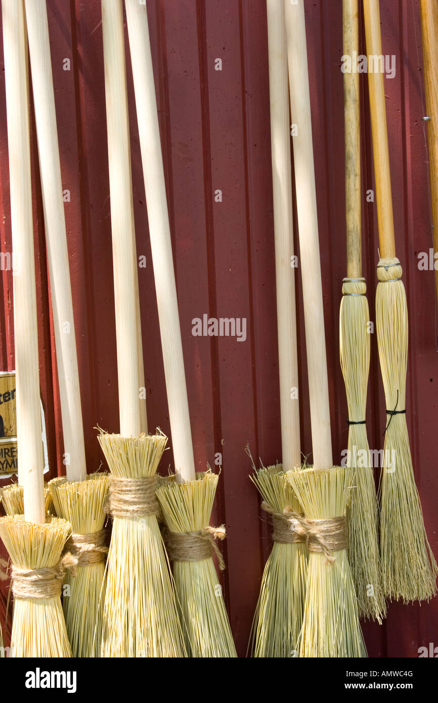 Brooms on display for sale at broom factory Stock Photo Alamy
