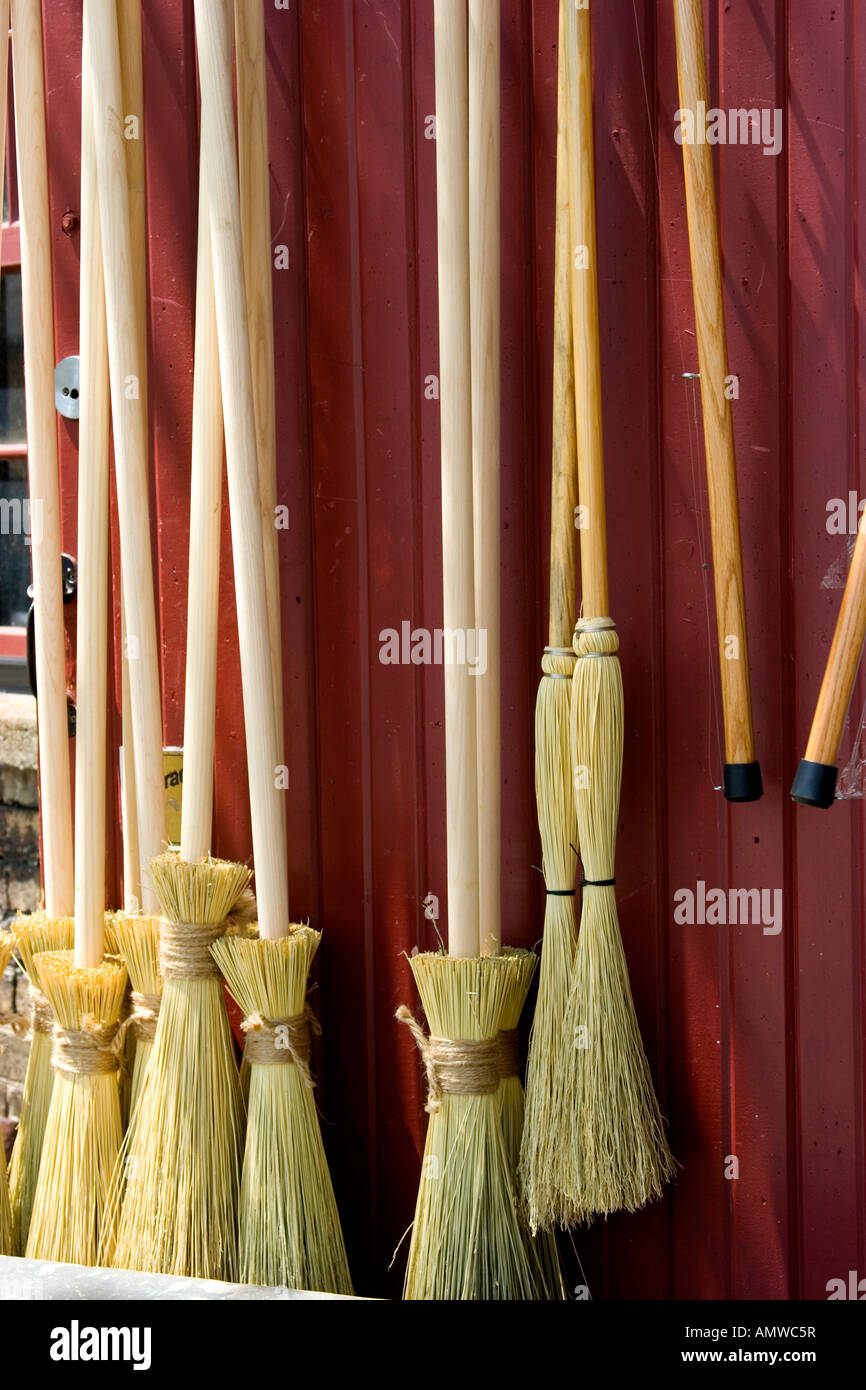 Brooms on display for sale at broom factory Stock Photo Alamy