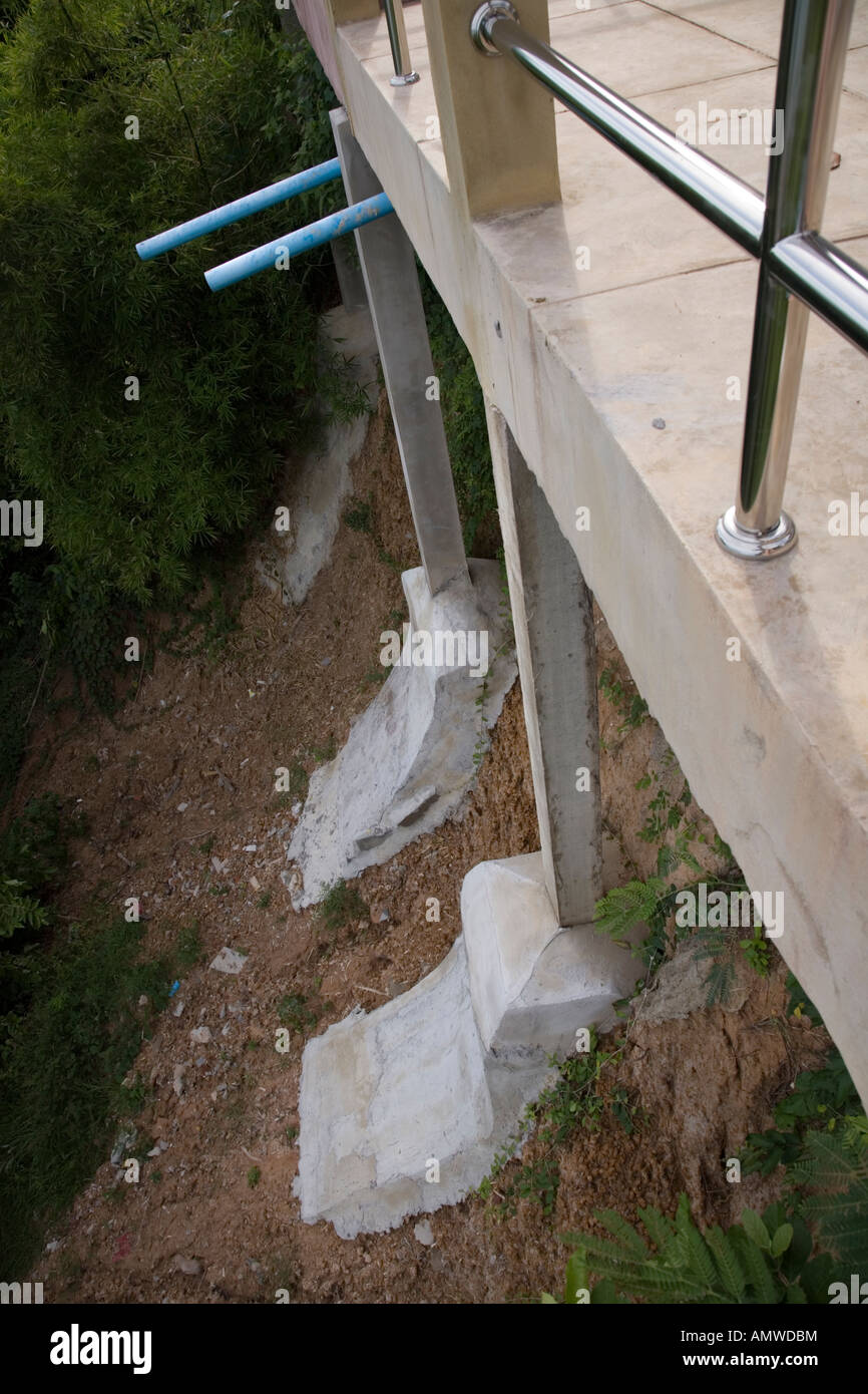 Reinforced concrete stilts supporting a concrete platform in Thailand