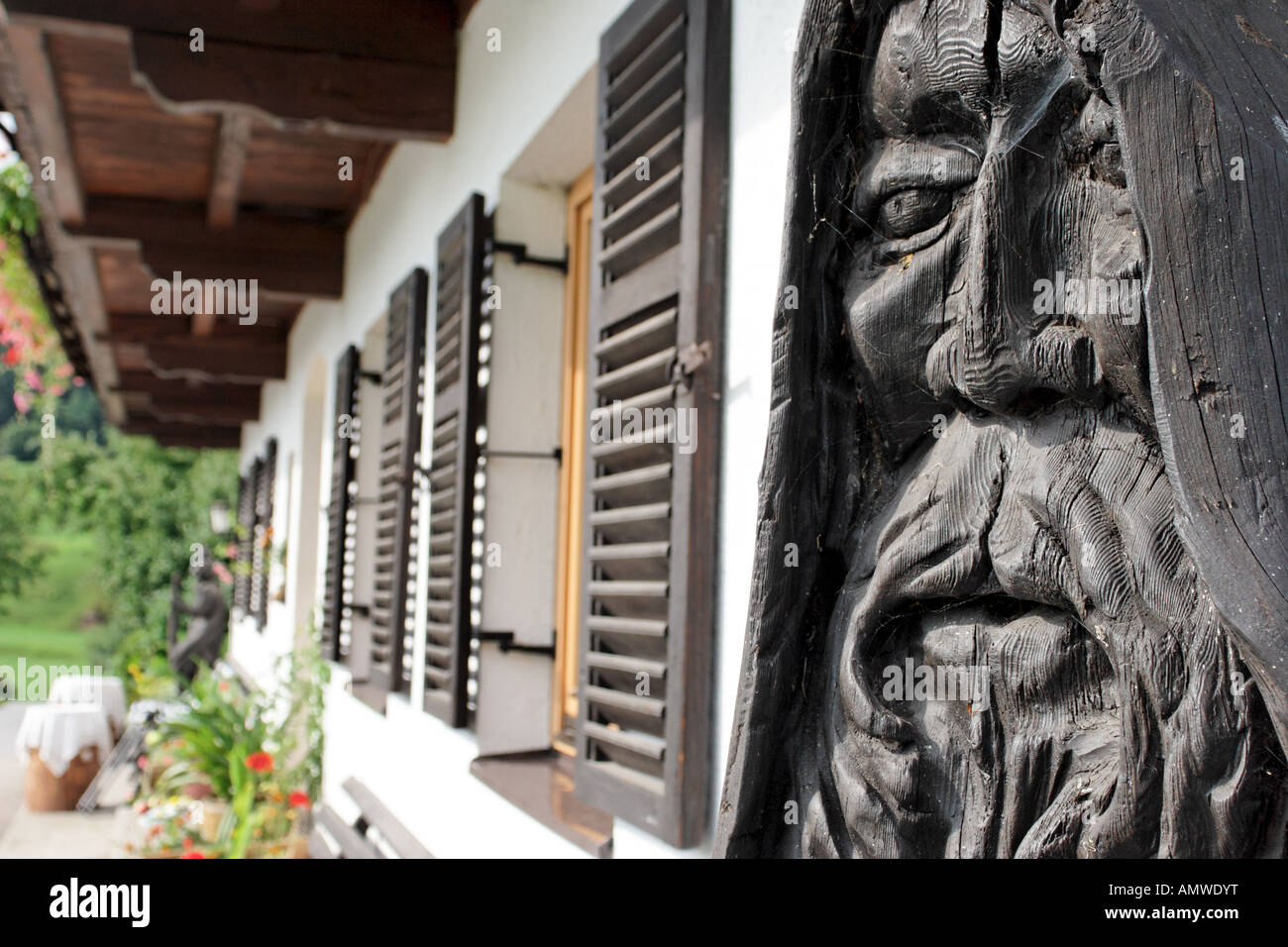 Austrian farm house Wood carved old man at the front of an Austrian