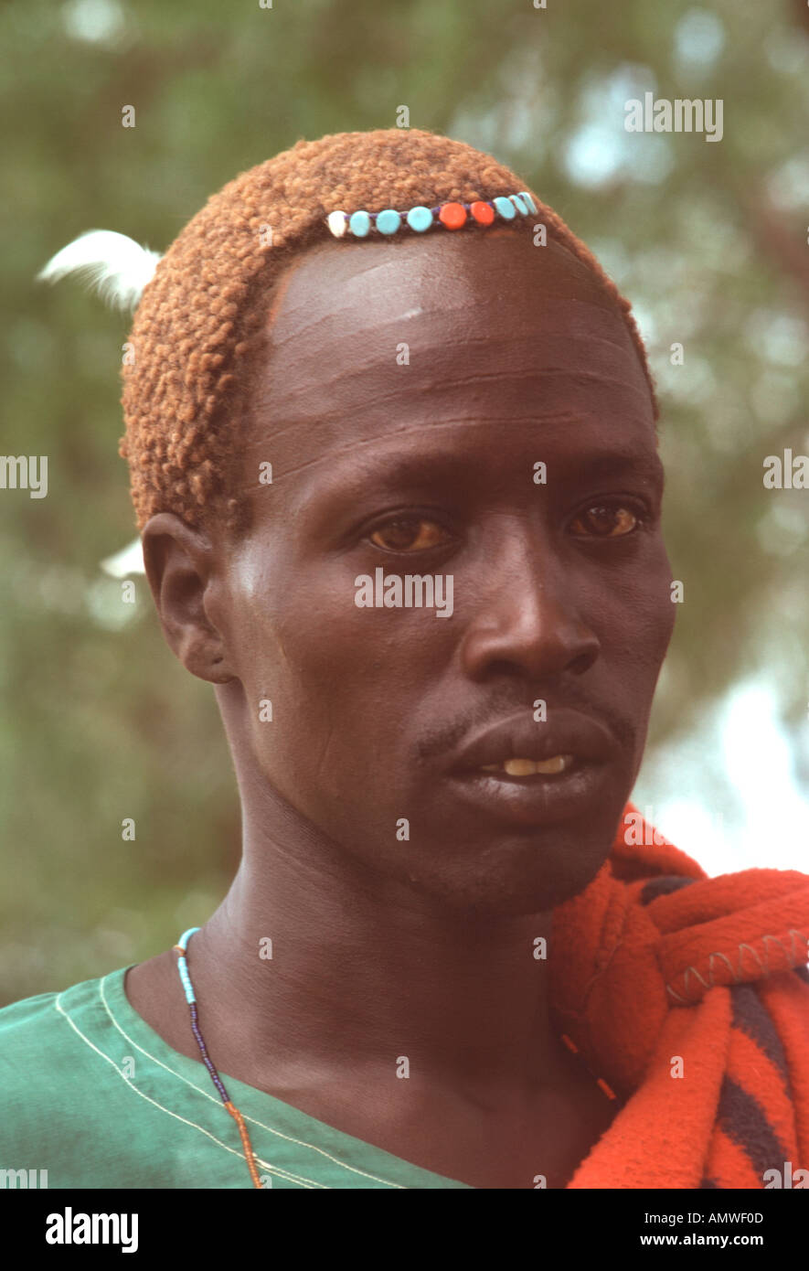 A young Dinka man with tribal scars on his forehead has a neat hairdo simply adorned with beads Stock Photo - Alamy A young Dinka man with tribal scars on his forehead has a neat hairdo simply adorned with beads Stock Photo - Alamy