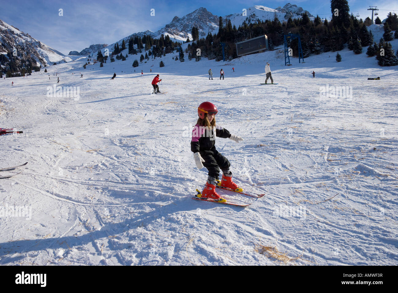 Young skier at snowy ski resort of Chimbulak Kazakhstan Stock Photo