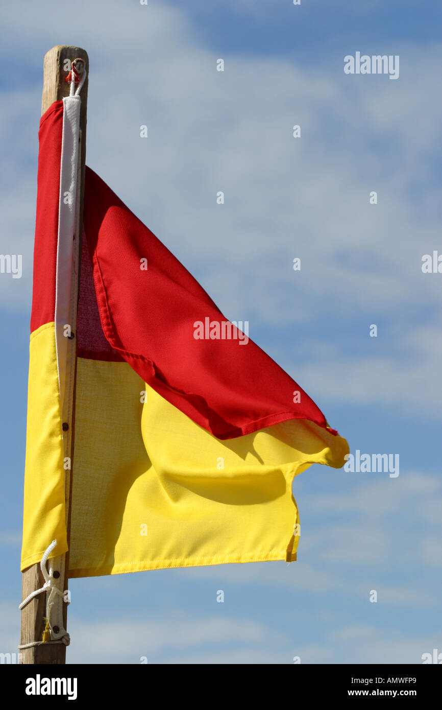 Beach sea warning flag red and yellow Stock Photo Alamy