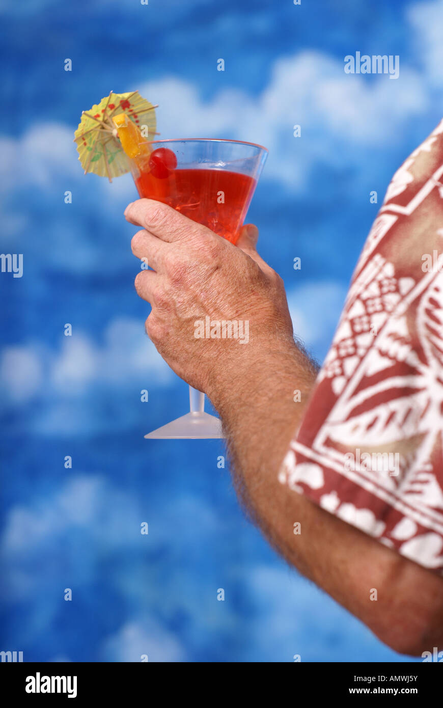 Hand holding cocktail umbrella hi-res stock photography and images - Alamy